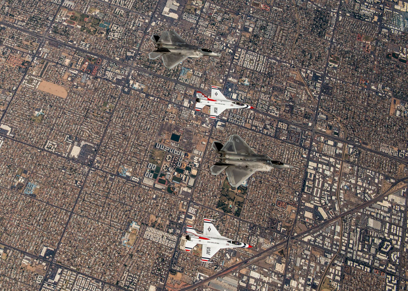 Illustration for article titled These Photos Of Thunderbirds F-16s Flying With F-22 Raptors Is A Whole Lot Of America